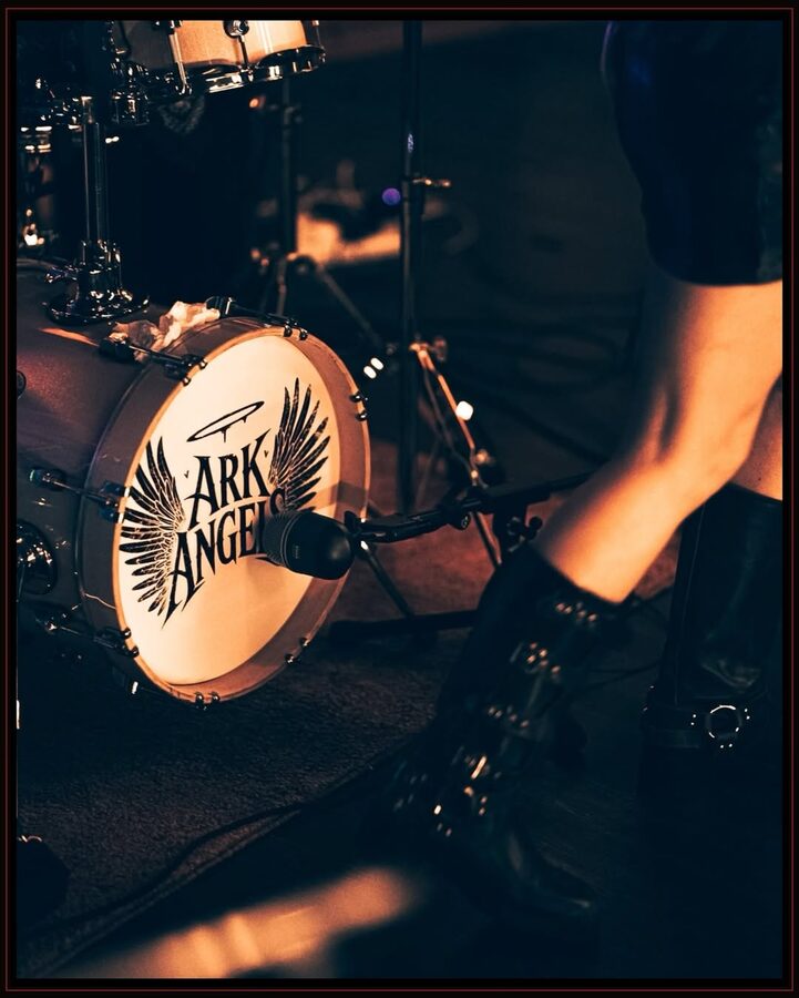 Ark Angels branded kick drum under stage light